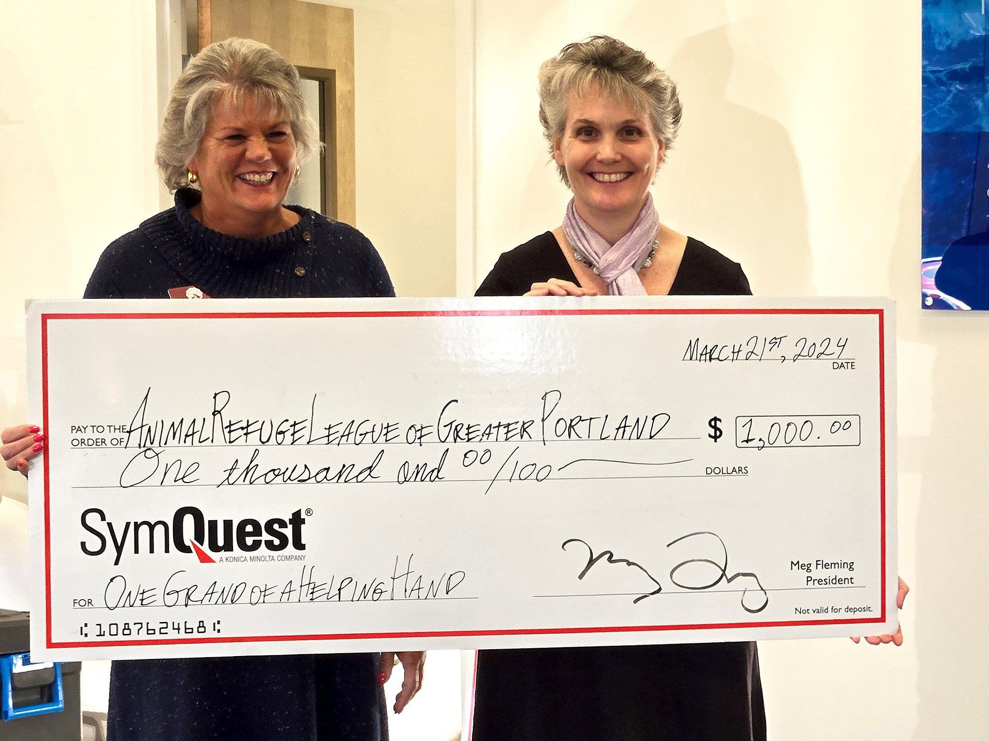 Animal Refuge League of Greater Portland Receives Check at SymQuest Westbrook Ribbon Cutting